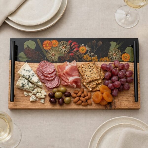 Australian botanical resin serving board styled with cheese, crackers and grazing foods on neutral linen.