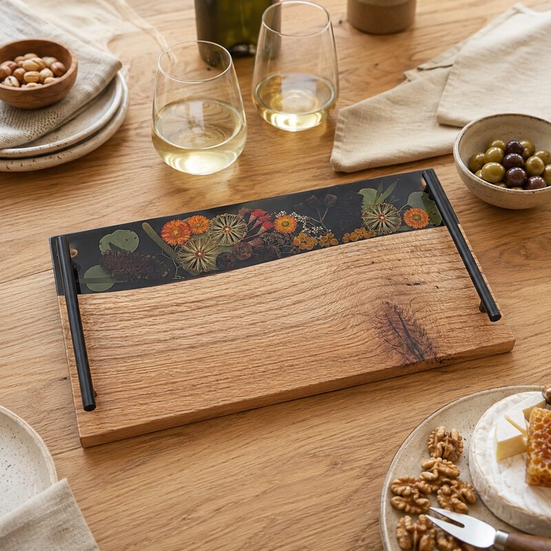 Handmade timber and botanical resin serving board displayed in a warm contemporary Australian home.