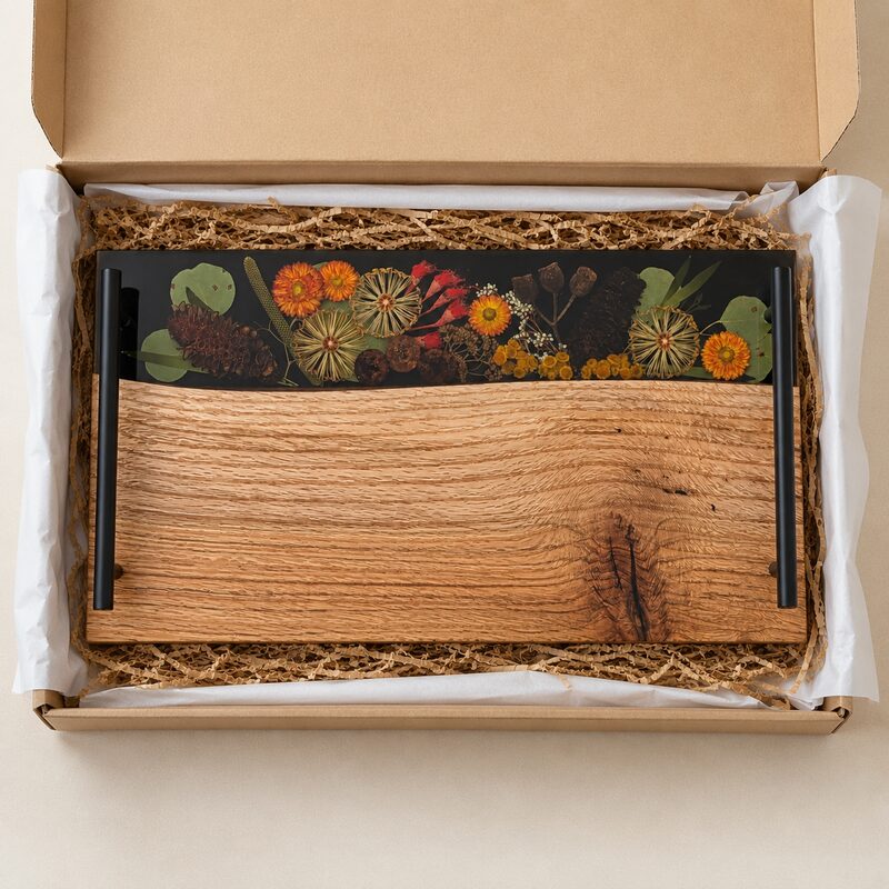 Australian botanical resin serving board presented in a natural kraft gift box with protective paper.