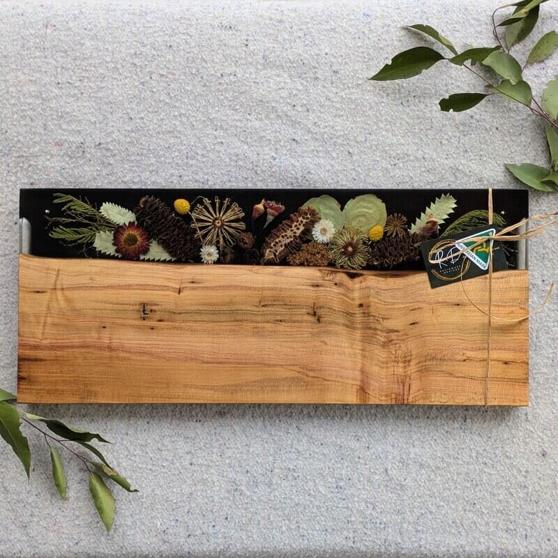 All Australian hand made and designed this makes the perfect special occasion gift for a loved one overseas, with embedded dried Australian flora in resin to preserve their natural beauty accompanied by the warm tones of timber this piece is a truly one of a kind piece that will be cherished for years to come.