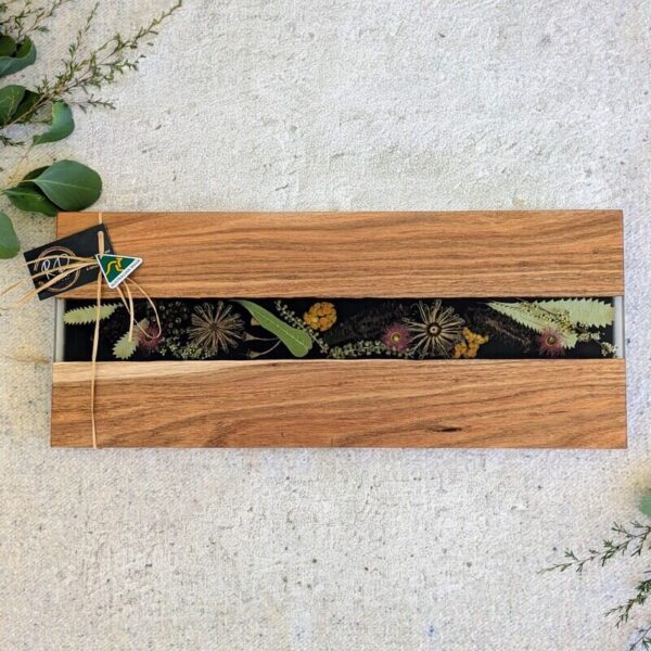 Handcrafted from locally sourced timber, this elegant board showcases a striking floral design inspired by the beauty of the Australian bush. Whether your hosting a brunch or a soiree, this versatile board is ideal for cheese, fruits, or hors d’oeuvres in style. Not only is it a stunning addition to any kitchen or dining space, but it also celebrates the unique flora of Australia. Give that special someone a gift that combines functionality, elegance, and a touch of Australian charm.