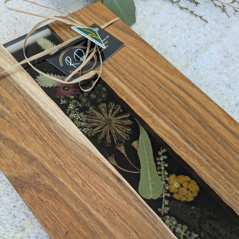 Handcrafted from locally sourced timber, this elegant board showcases a striking floral design inspired by the beauty of the Australian bush. Whether your hosting a brunch or a soiree, this versatile board is ideal for cheese, fruits, or hors d’oeuvres in style. Not only is it a stunning addition to any kitchen or dining space, but it also celebrates the unique flora of Australia. Give that special someone a gift that combines functionality, elegance, and a touch of Australian charm.
