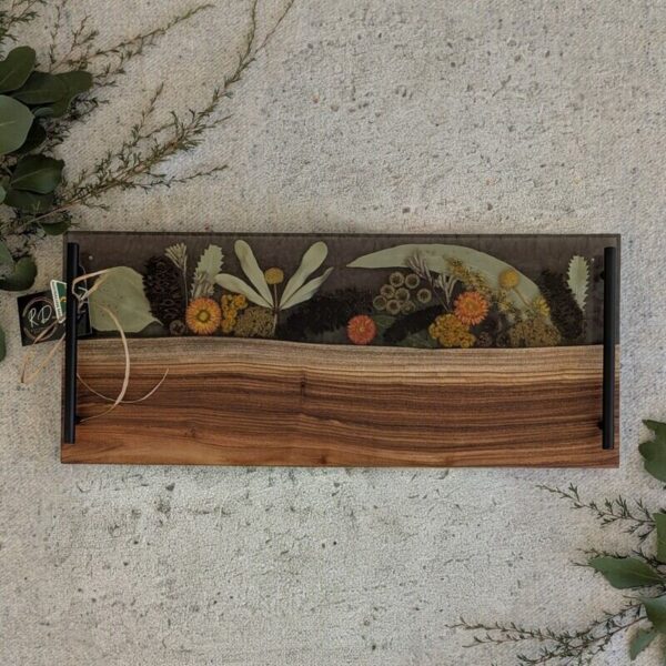 The Perfect Gift done for you. Elevate your entertaining with our stunning handcrafted timber resin and Australian wildflower serving platters! Perfect for serving your favorite cheeses at home or as a unique gift for someone special. Each platter is a one-of-a-kind piece, showcasing the beauty of nature. Don't miss out-bring home a piece of art today! Shop now and impress your guests or delight a loved one!