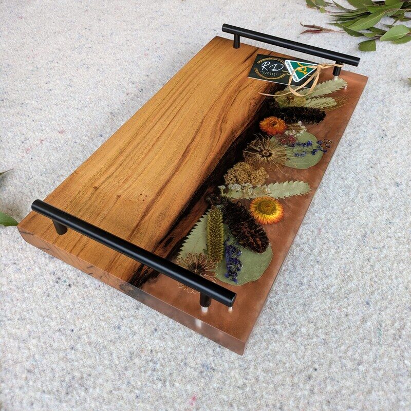 Celebrate any special occasion with this exquisite keepsake Australian Flora timber cheese board – a luxurious gift for that special day! Crafted with native Australian flora designs, it exudes elegance and charm. Perfect for pampering moments, its not just a cheese board but a beautiful addition to home décor. This thoughtful gift will surely to make anyone feel cherished and loved. Make someone's day extra special with this unique and stylish cheese board – a perfect blend of functionality and beauty!