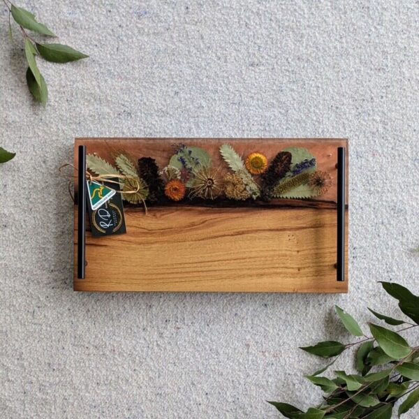 Celebrate any special occasion with this exquisite keepsake Australian Flora timber cheese board – a luxurious gift for that special day! Crafted with native Australian flora designs, it exudes elegance and charm. Perfect for pampering moments, its not just a cheese board but a beautiful addition to home décor. This thoughtful gift will surely to make anyone feel cherished and loved. Make someone's day extra special with this unique and stylish cheese board – a perfect blend of functionality and beauty!