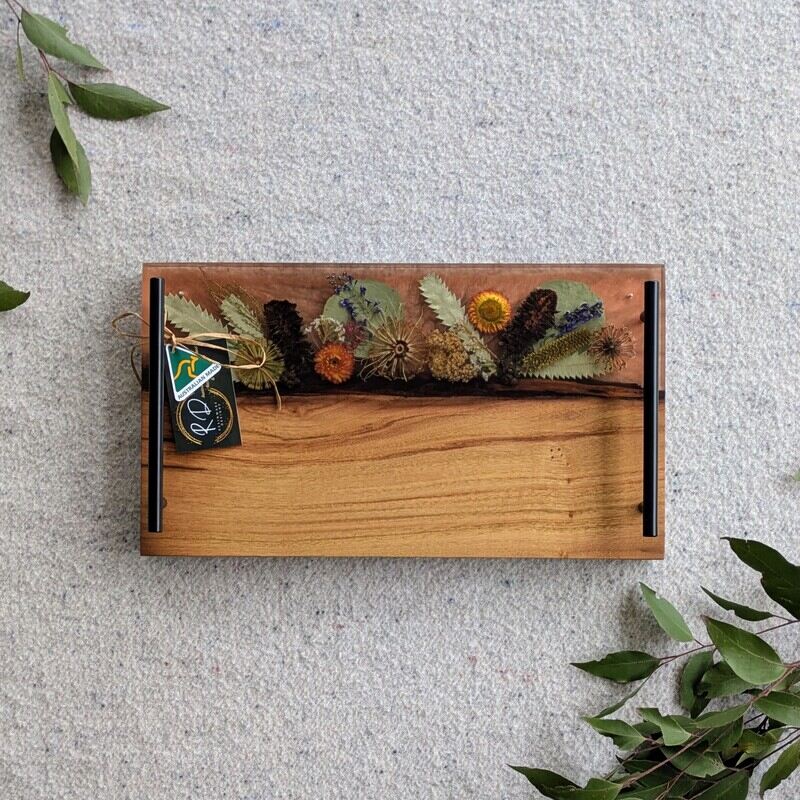 Celebrate any special occasion with this exquisite keepsake Australian Flora timber cheese board – a luxurious gift for that special day! Crafted with native Australian flora designs, it exudes elegance and charm. Perfect for pampering moments, its not just a cheese board but a beautiful addition to home décor. This thoughtful gift will surely to make anyone feel cherished and loved. Make someone's day extra special with this unique and stylish cheese board – a perfect blend of functionality and beauty!