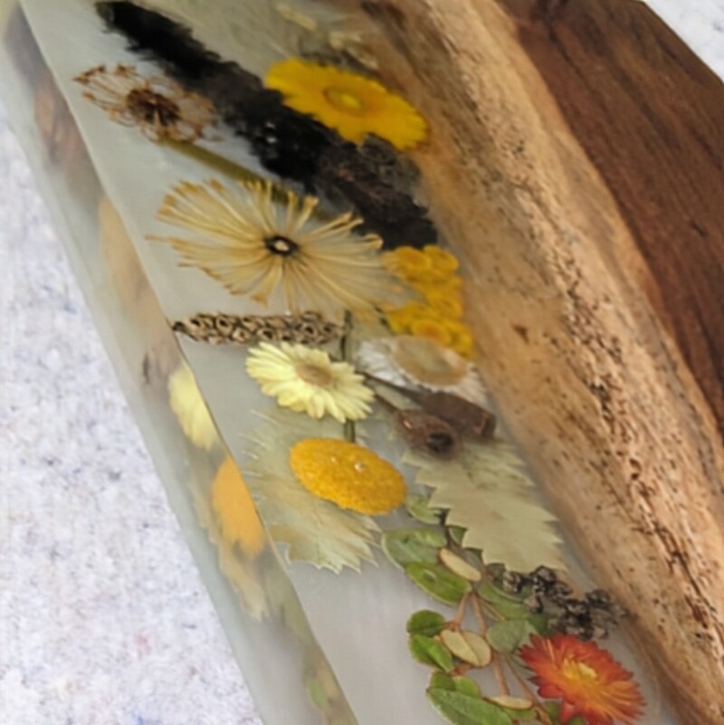 This charcuterie board will be great On mums’ special day, go beyond the ordinary and gift your mum something extraordinary with this handcrafted Flora, timber and resin grazing board that embodies love, artistry, and the timeless beauty of Australia. Let every meal shared on this board be a celebration of the bond you share, the memories you create, and the love that binds you together.