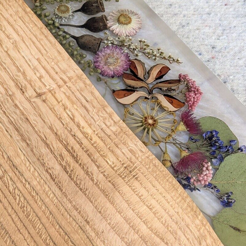 Celebrate any special occasion with this exquisite keepsake Australian Flora timber cheese board – a luxurious gift for that special day! Crafted with native Australian flora designs, it exudes elegance and charm. Perfect for pampering moments, its not just a cheese board but a beautiful addition to home décor. This thoughtful gift will surely to make anyone feel cherished and loved. Make someone's day extra special with this unique and stylish cheese board – a perfect blend of functionality and beauty!