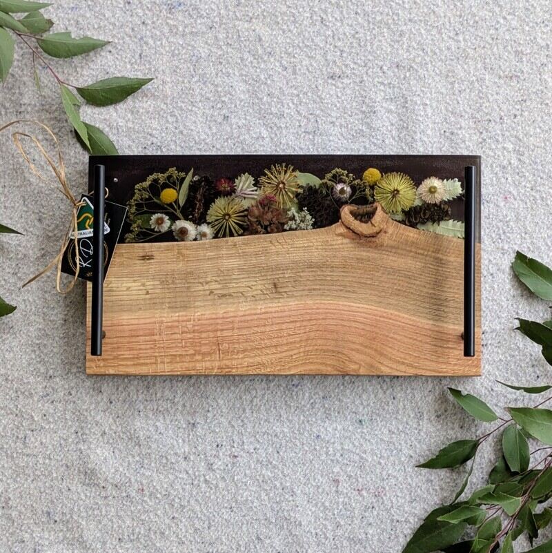 Celebrate any special occasion with this exquisite keepsake Australian Flora timber cheese board – a luxurious gift for that special day! Crafted with native Australian flora designs, it exudes elegance and charm. Perfect for pampering moments, its not just a cheese board but a beautiful addition to home décor. This thoughtful gift will surely to make anyone feel cherished and loved. Make someone's day extra special with this unique and stylish cheese board – a perfect blend of functionality and beauty!