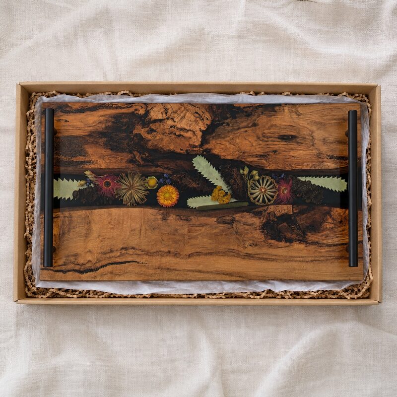 Australian wildflower timber and resin charcuterie board presented inside a fitted natural kraft gift box.