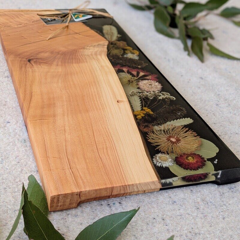 This Resin Board is a super special with its dried Florals. All of our serving boards are one of a kind and can never be replicated! This board makes a wonderful special occasion gift whether its newlyweds or a housewarming gift.