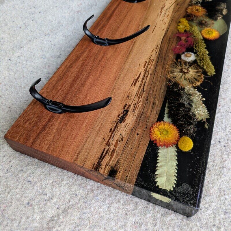 This one of a kind coat rack is so unique with its Australian dried flora embedded in resin and featuring Australian iron bark timber it is sure to impress placed in your door entry or hallway.
