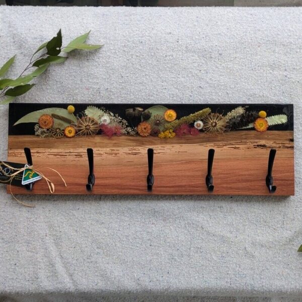 This one of a kind coat rack is so unique with its Australian dried flora embedded in resin and featuring Australian iron bark timber it is sure to impress placed in your door entry or hallway.