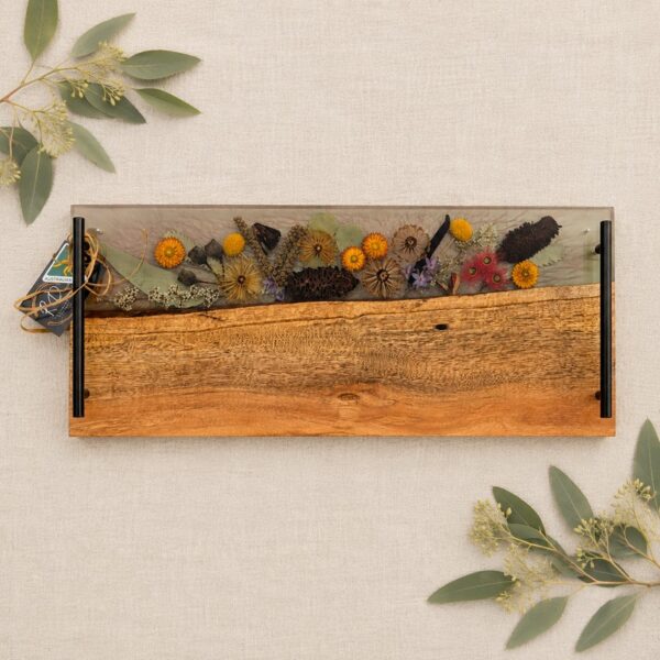 Celebrate her special day with a gift as enchanting and unique as she is. Our Handcrafted Timber, Resin, and Australian Floral Grazing Board is the perfect luxury gift for the bride on her wedding day, meticulously crafted to capture the essence of natural beauty.