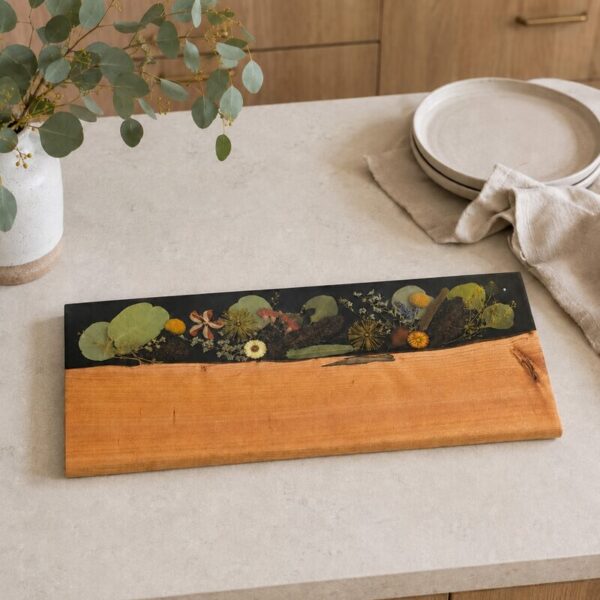 Large handcrafted timber and botanical resin serving board on a contemporary Australian kitchen island.