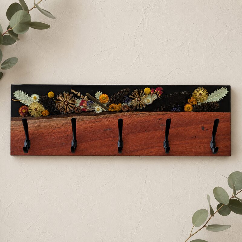 Handcrafted Australian red gum and black botanical resin coat rack with five hooks, ideal as a unique housewarming gift.