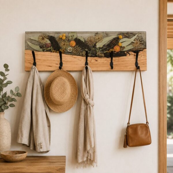 Australian botanical timber coat rack styled with a linen jacket, hat, scarf and leather bag in a warm entryway.