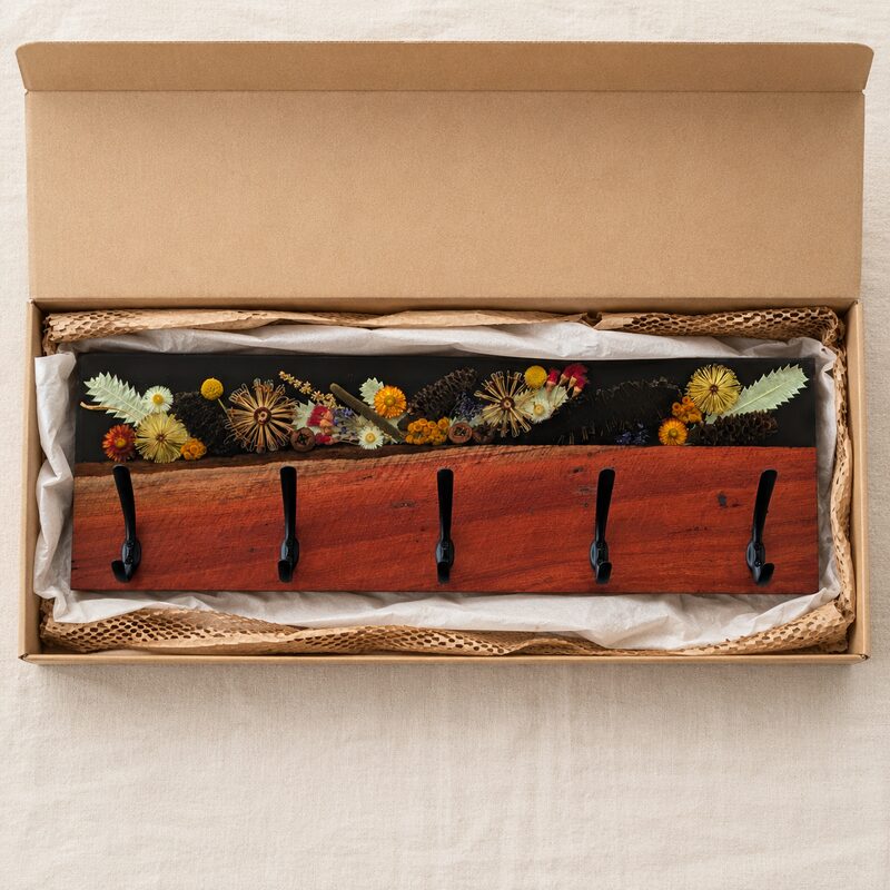 Australian red gum and botanical resin coat rack presented in a kraft gift box for a wedding or housewarming gift.